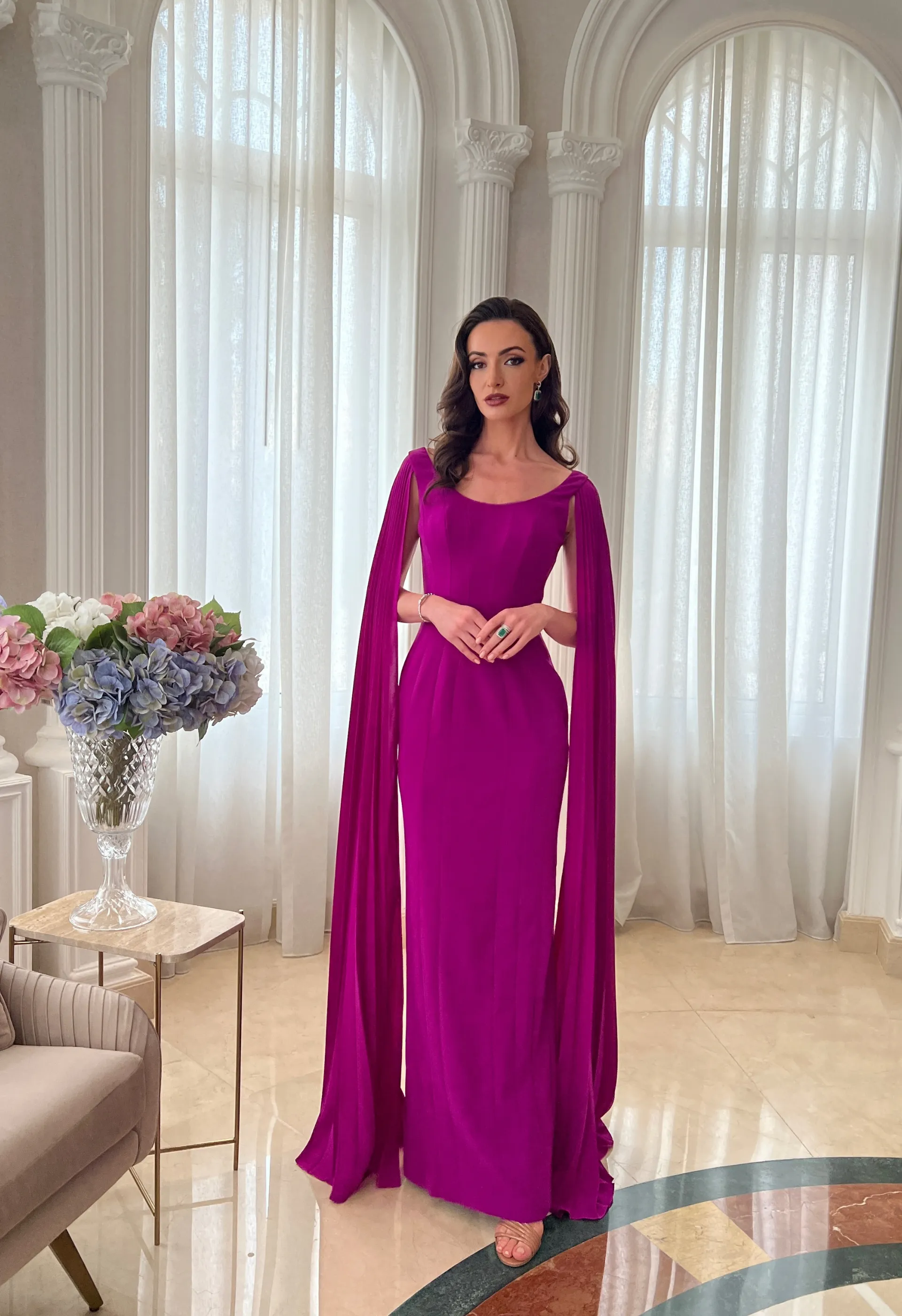 Gown with pleated cape sleeves